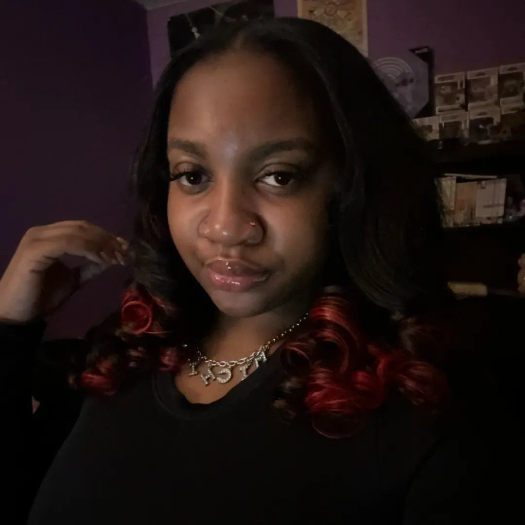 Quick weave styled with red curled ends