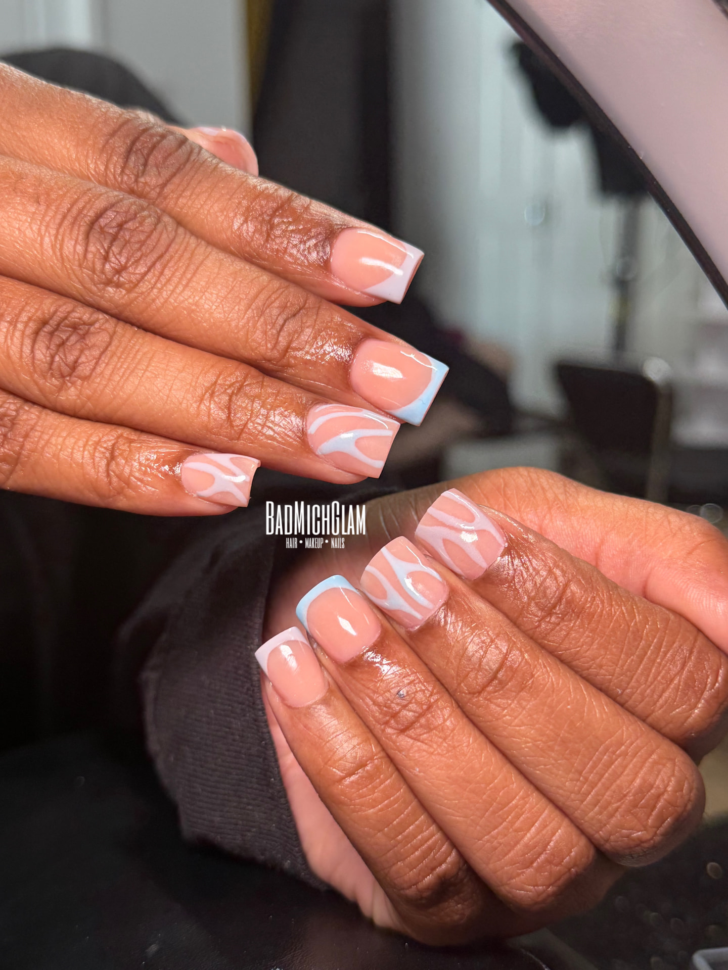 Pink French tip nails with white polka dots
