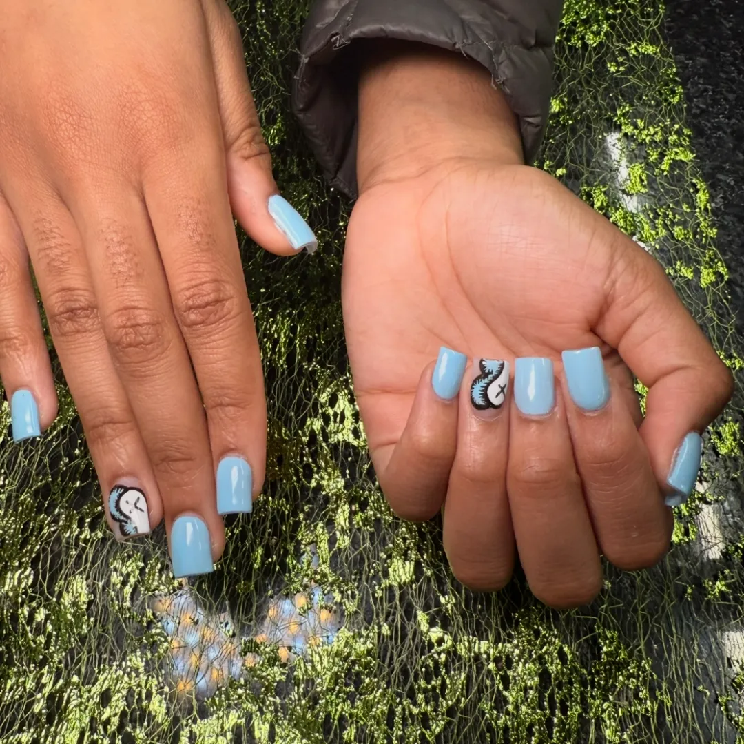 Baby blue square nails with black and white character art