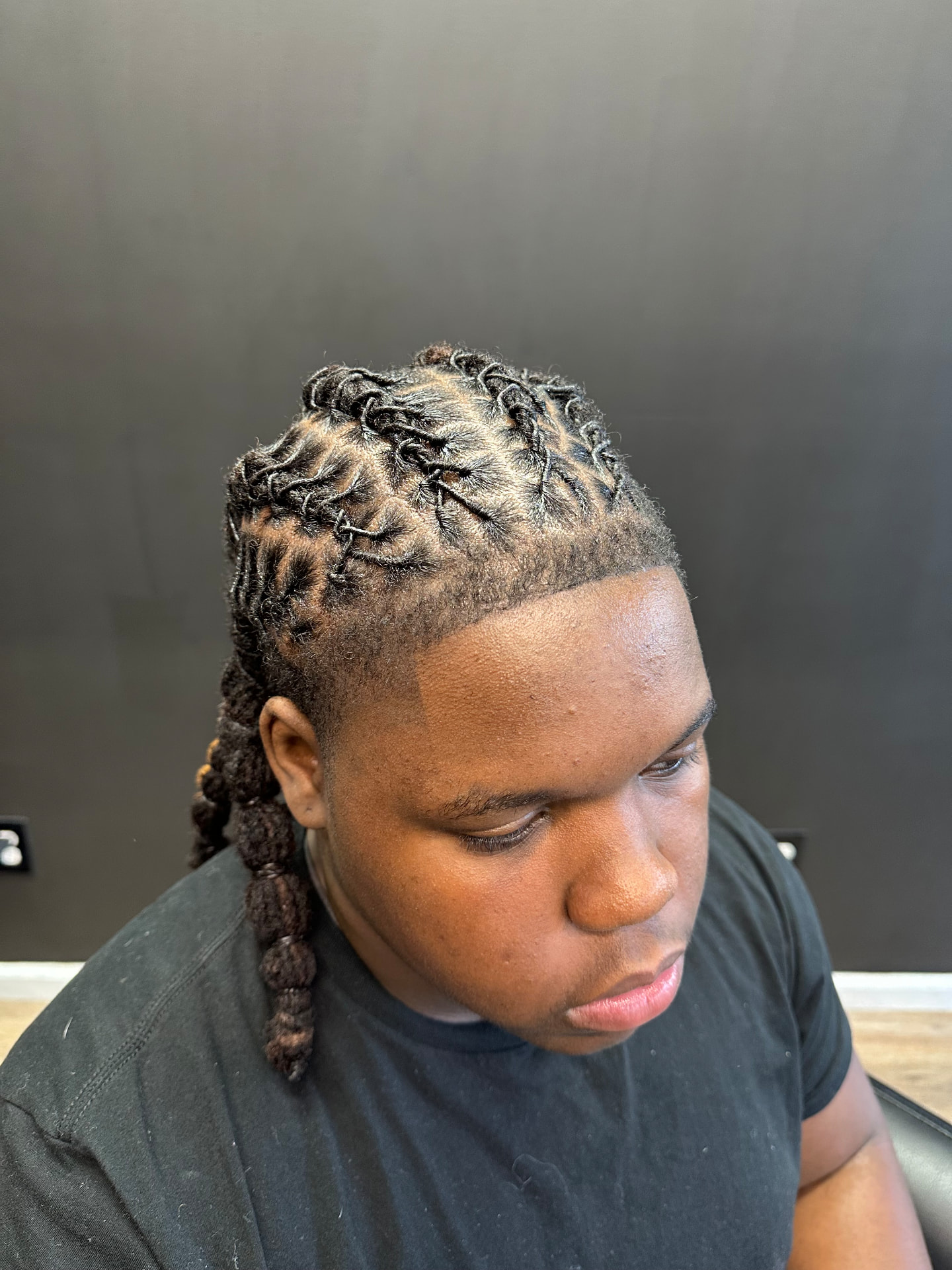 Locs styled in barrel twists