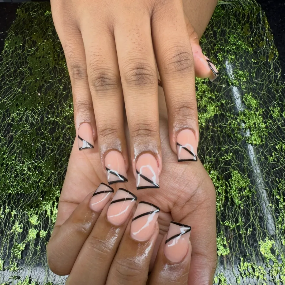 Nude nails with black and white abstract line French tips