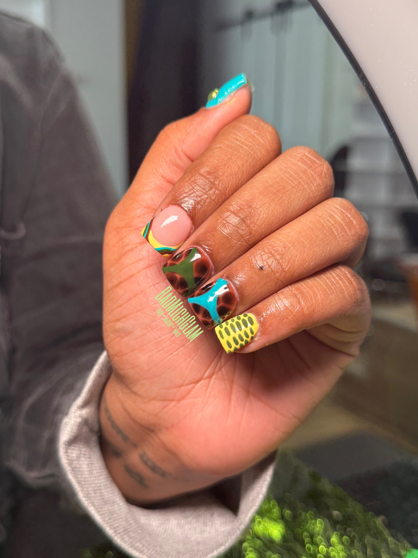 Short square nails with mixed animal print, turquoise and yellow abstract art