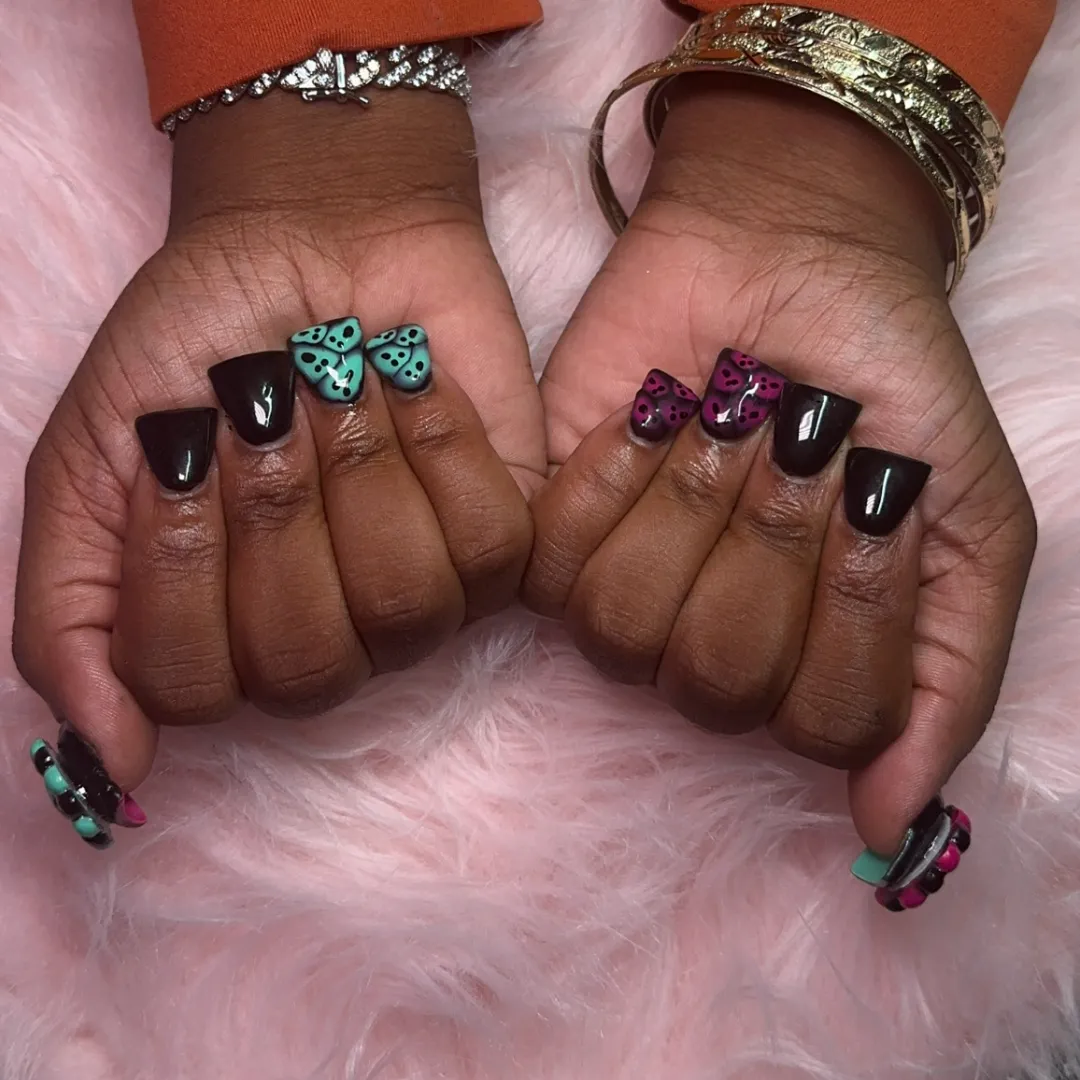 Dark cherry nails with teal and pink 3D butterfly accents