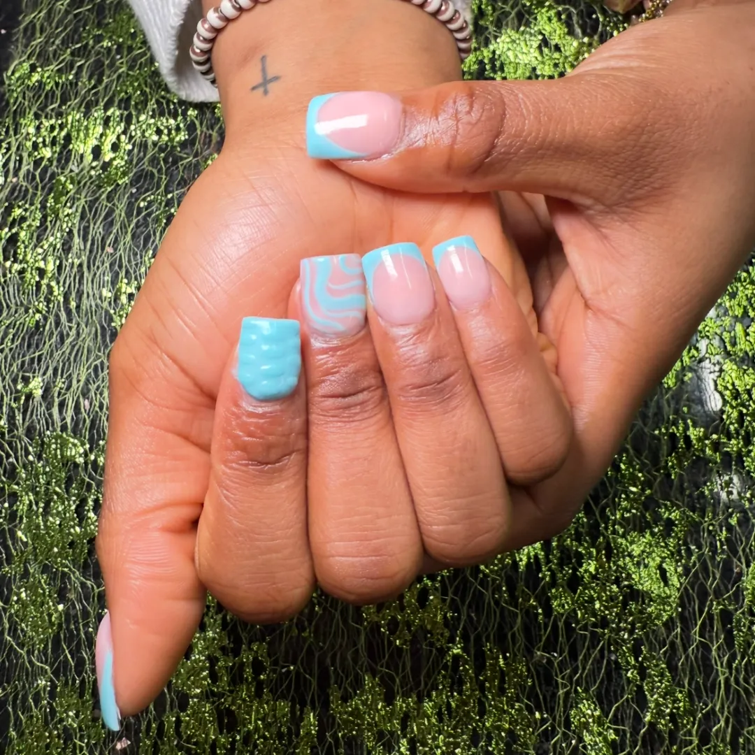 Pink and blue swirl French tip nails